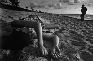 Woman lying on the sand